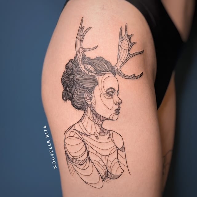 Fine-line portrait of a woman with antlers and flowing anatomical linework on an upper arm.